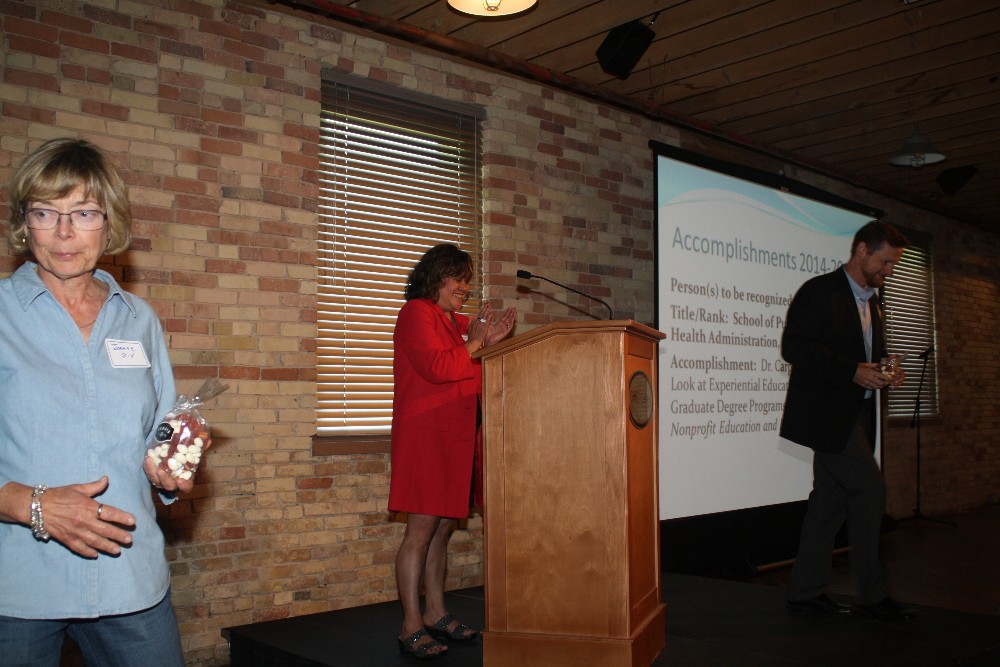 Dr. Diane Kimoto Bonetti presenting awards to CAC members